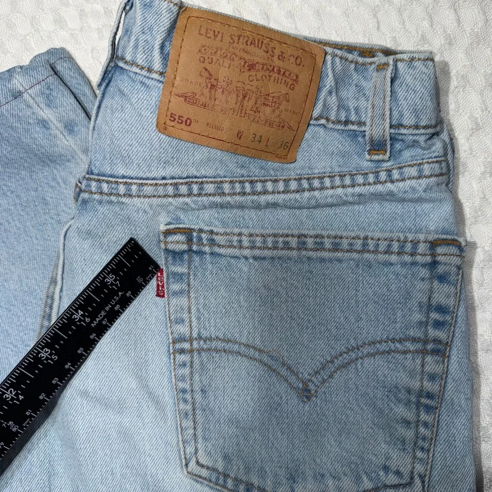 VTG 90s Levis 550 Relaxed Fit Distressed Jeans Mens 34x36 Light Wash Made in USA